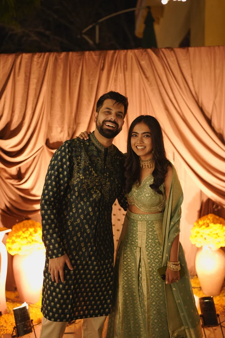 Sagar and Tanya smiling at their wedding